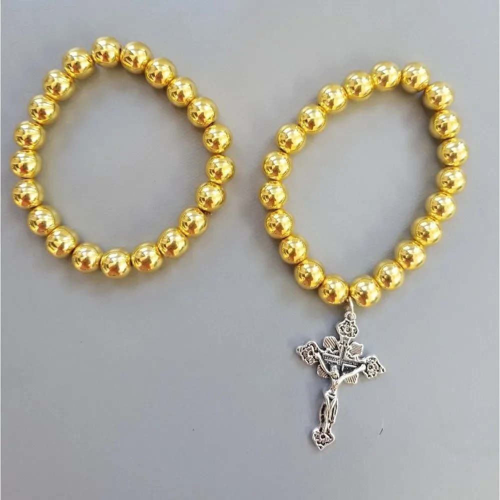 1 gold bracelet with cross charm